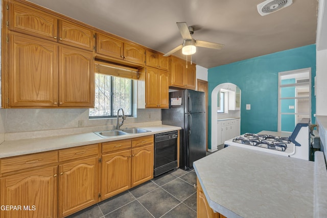 1003 Alethea Park Dr, El Paso, TX 79902 - kitchen featuring a sink, light countertops, arched walkways, a ceiling fan, and black appliances