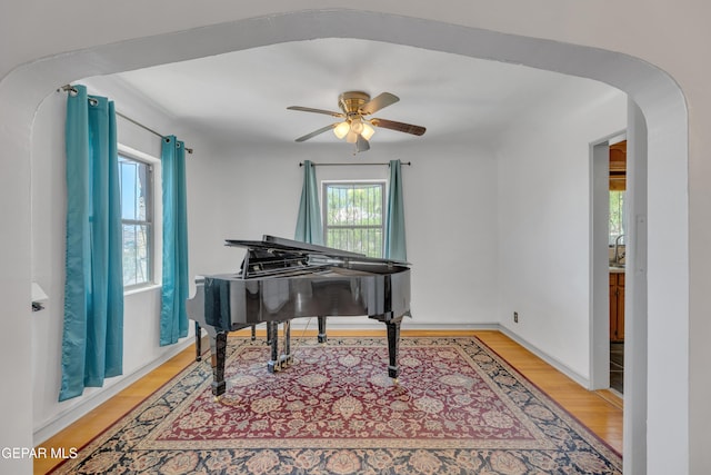 1003 Alethea Park Dr, El Paso, TX 79902 - sitting room featuring arched walkways, ceiling fan, and wood finished floors