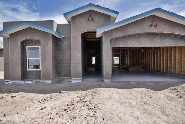 property under construction featuring an attached garage