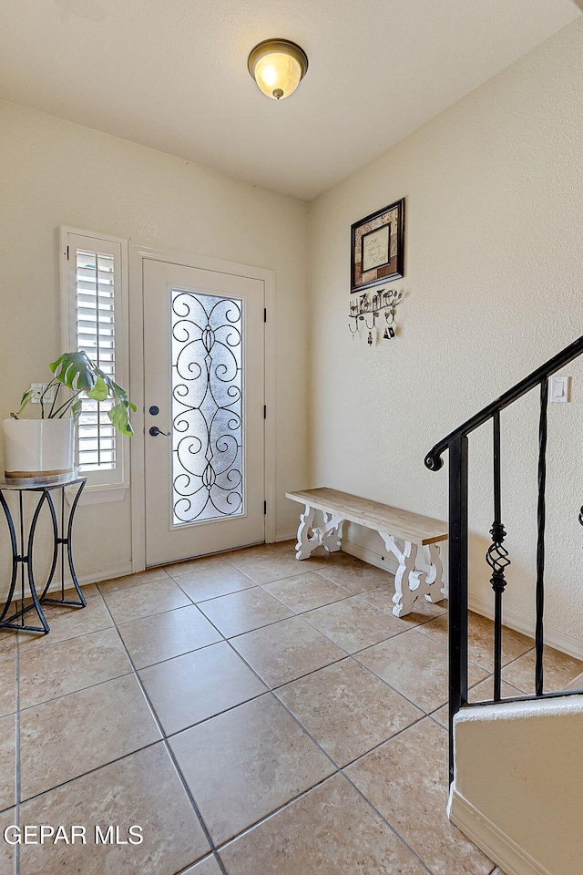 entrance foyer with light tile patterned flooring