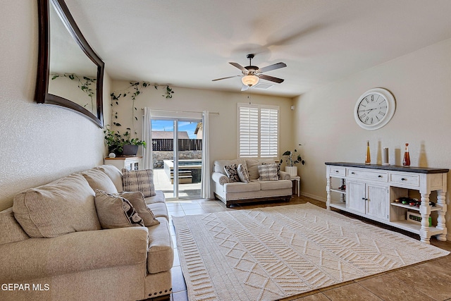 living area with ceiling fan