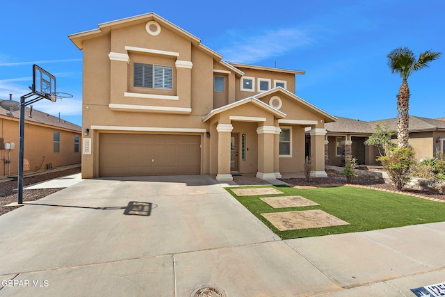 traditional home featuring a front yard, stucco siding, driveway, and an attached garage