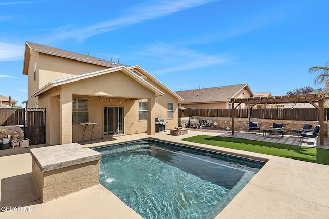 rear view of property featuring a patio, a fenced backyard, and stucco siding
