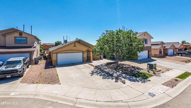 view of front of home featuring concrete driveway, a garage, a residential view, and stucco siding