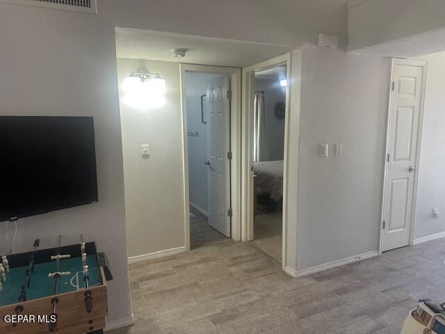 interior space featuring baseboards and visible vents