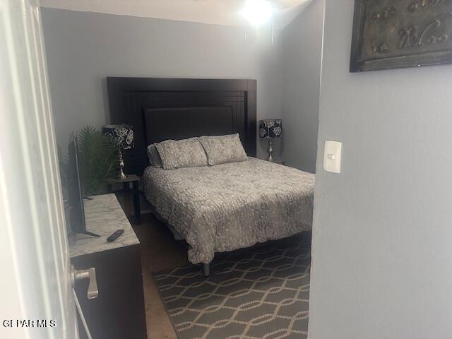 bedroom featuring a fireplace
