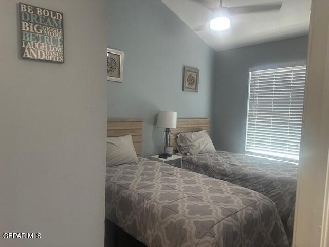 bedroom featuring a ceiling fan and vaulted ceiling