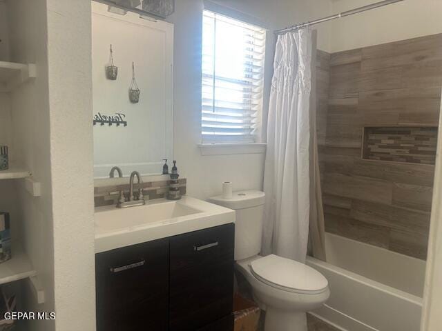 bathroom featuring vanity, shower / bath combo with shower curtain, and toilet
