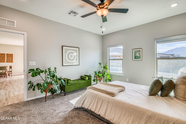 carpeted bedroom featuring visible vents, recessed lighting, baseboards, and a ceiling fan