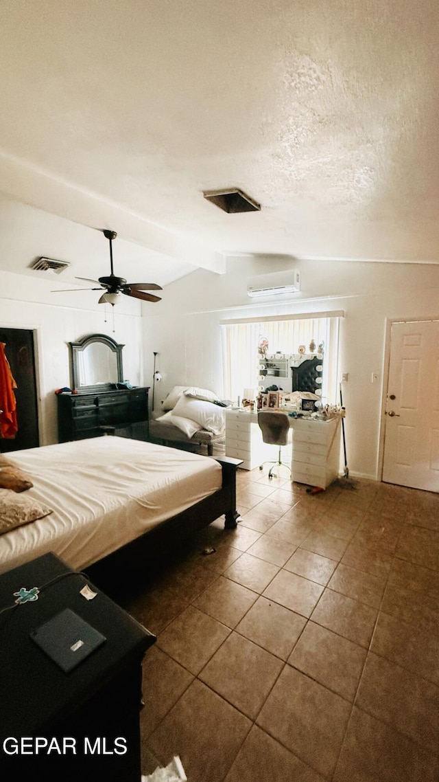 tiled bedroom with ceiling fan, visible vents, a wall unit AC, a textured ceiling, and lofted ceiling