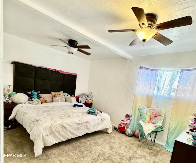 carpeted bedroom featuring a textured ceiling, ceiling fan, and a textured wall