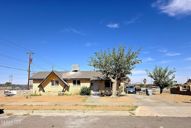 5001 Winthrop Dr, El Paso, TX 79924 - view of front of house featuring concrete driveway, brick siding, and a shingled roof