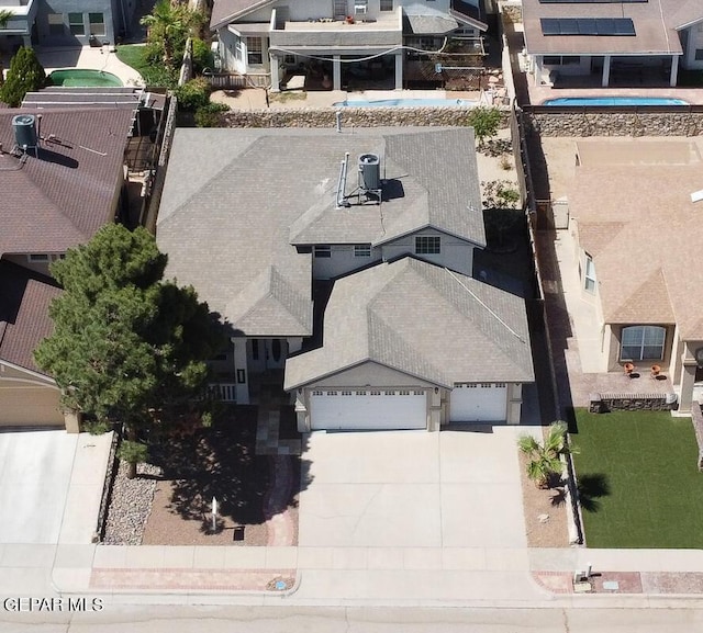 12617 Sun Spirit Dr, El Paso, TX 79938 - aerial perspective of suburban area with a pool area