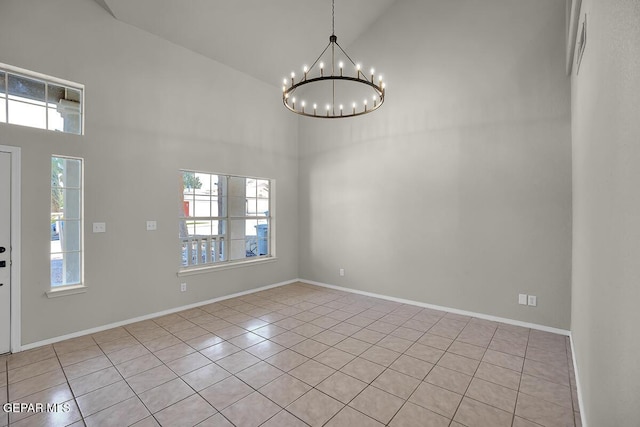 12617 Sun Spirit Dr, El Paso, TX 79938 - spare room featuring high vaulted ceiling, light tile patterned floors, healthy amount of natural light, and a chandelier