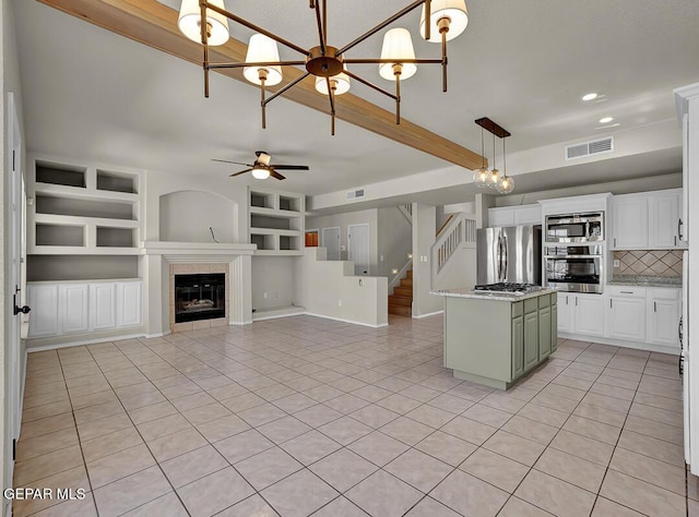 12617 Sun Spirit Dr, El Paso, TX 79938 - kitchen featuring stainless steel appliances, light tile patterned floors, tasteful backsplash, a ceiling fan, and decorative light fixtures