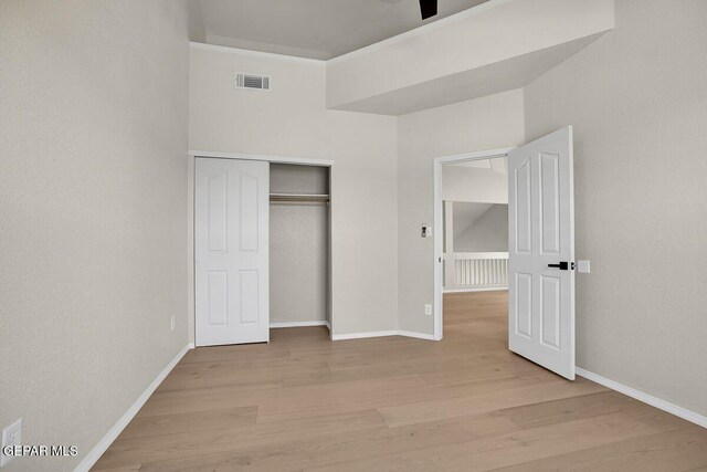 12617 Sun Spirit Dr, El Paso, TX 79938 - unfurnished bedroom featuring wood finished floors, baseboards, a closet, and ornamental molding