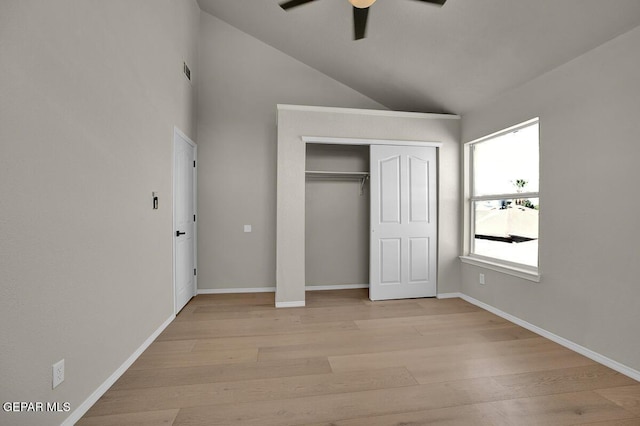 12617 Sun Spirit Dr, El Paso, TX 79938 - unfurnished bedroom with light wood finished floors, lofted ceiling, a closet, baseboards, and a ceiling fan