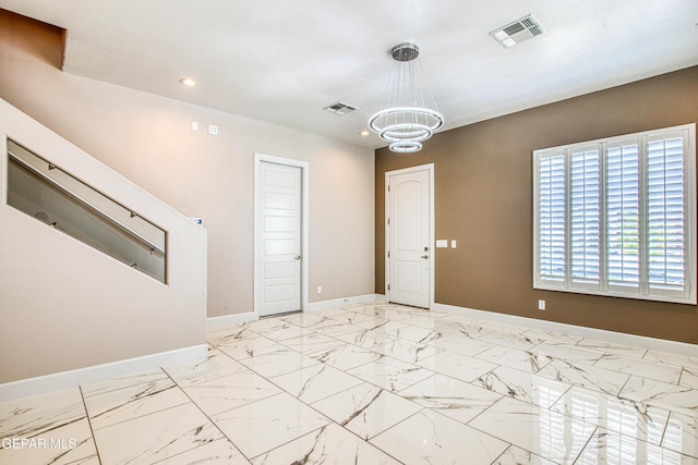 unfurnished room with recessed lighting, baseboards, visible vents, and an inviting chandelier