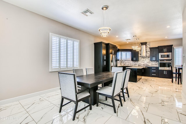 dining room with visible vents, marble finish floor, baseboards, recessed lighting, and a chandelier