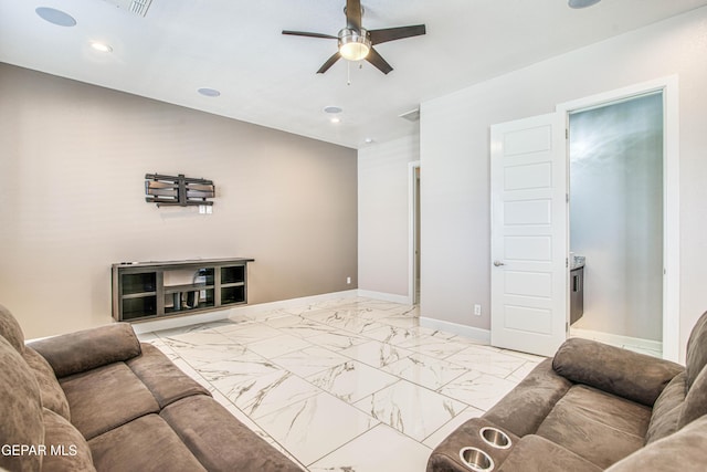 living area with recessed lighting, marble finish floor, ceiling fan, and baseboards