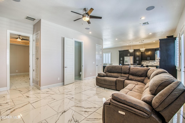 living room with visible vents, recessed lighting, baseboards, and ceiling fan