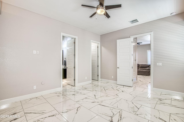 unfurnished bedroom with visible vents, marble finish floor, baseboards, a ceiling fan, and ensuite bath