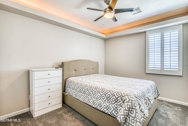bedroom featuring baseboards, carpet, a ceiling fan, and visible vents