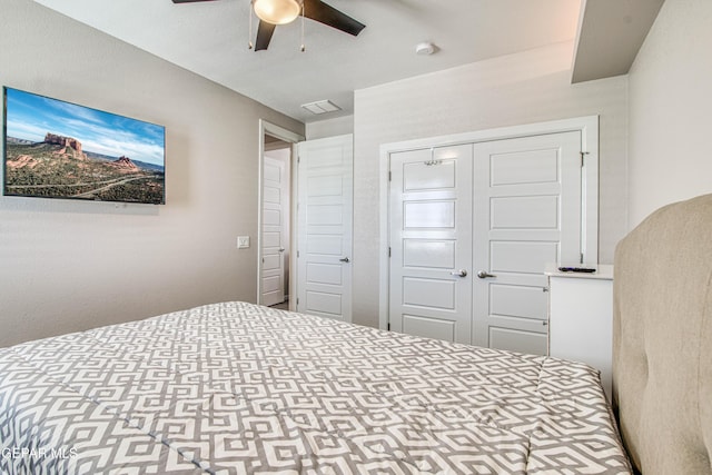bedroom featuring a ceiling fan, a closet, and visible vents