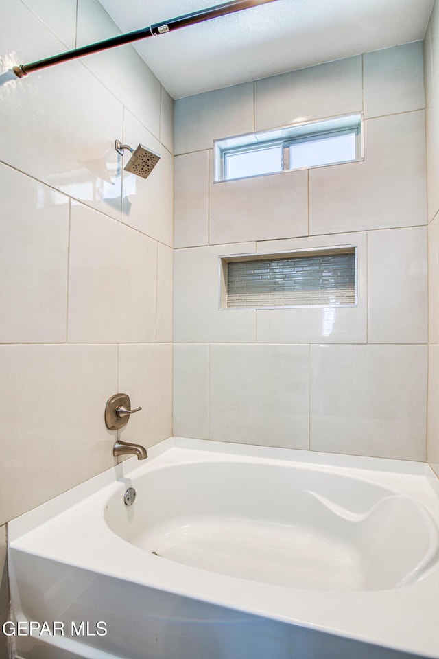 bathroom featuring bathing tub / shower combination