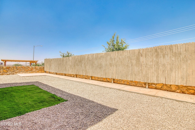 view of yard with a fenced backyard