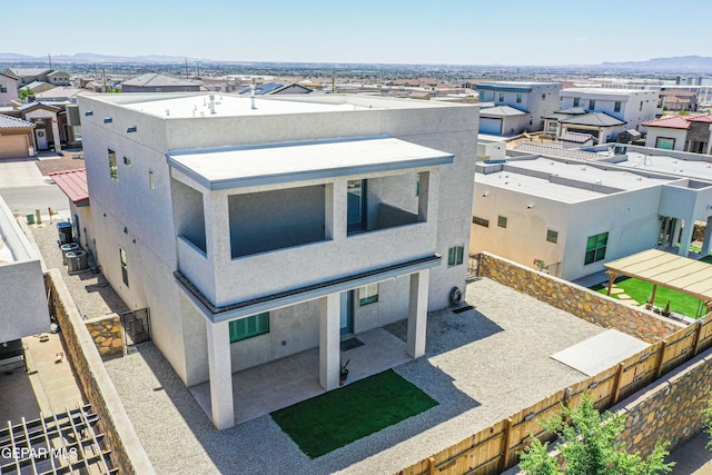 birds eye view of property with a mountain view and a residential view