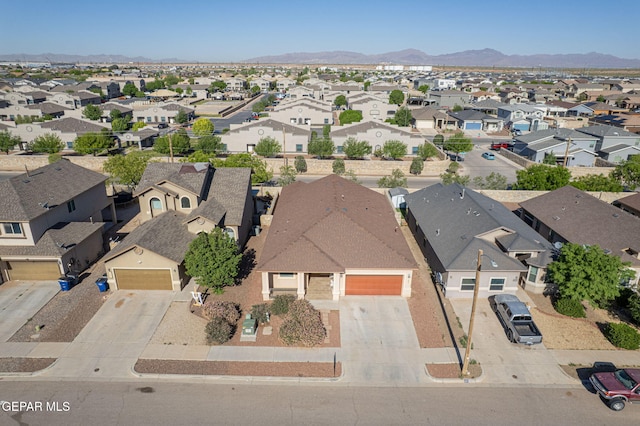 bird's eye view featuring a residential view and a mountain view
