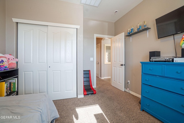 carpeted bedroom featuring a closet, baseboards, and visible vents