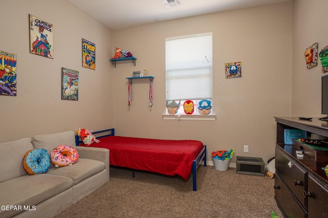 carpeted bedroom featuring baseboards and visible vents