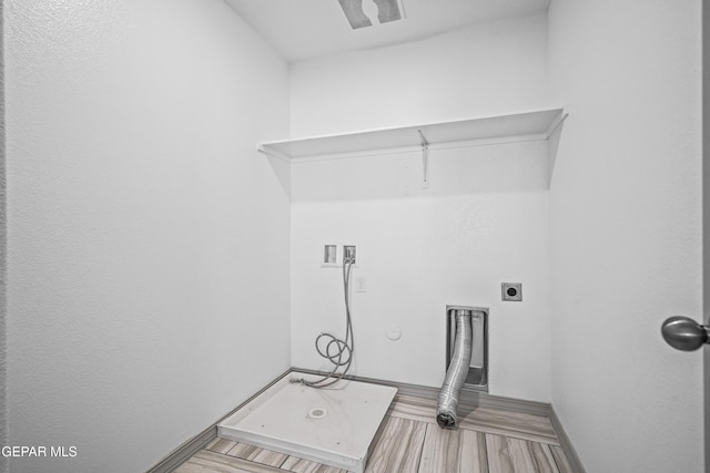 laundry area featuring washer hookup, hookup for an electric dryer, laundry area, baseboards, and light wood finished floors