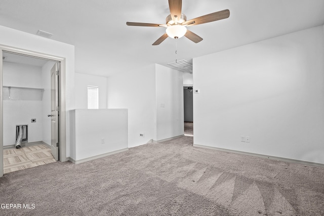 unfurnished bedroom featuring carpet floors, baseboards, visible vents, and ceiling fan