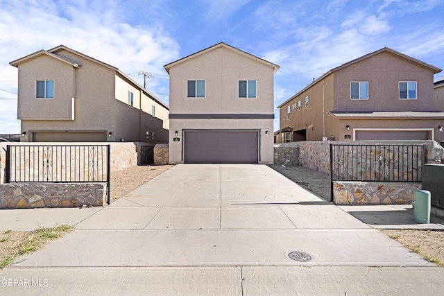 traditional home featuring an attached garage, fence, stucco siding, and driveway