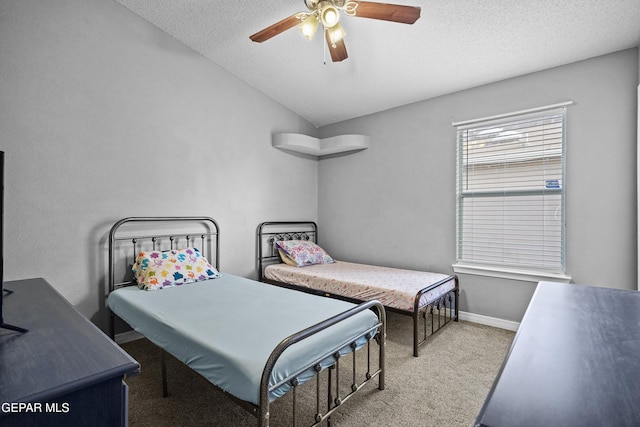 carpeted bedroom with baseboards, a ceiling fan, a textured ceiling, and lofted ceiling