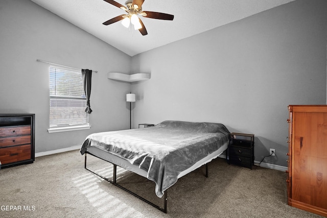 carpeted bedroom with baseboards, ceiling fan, and lofted ceiling