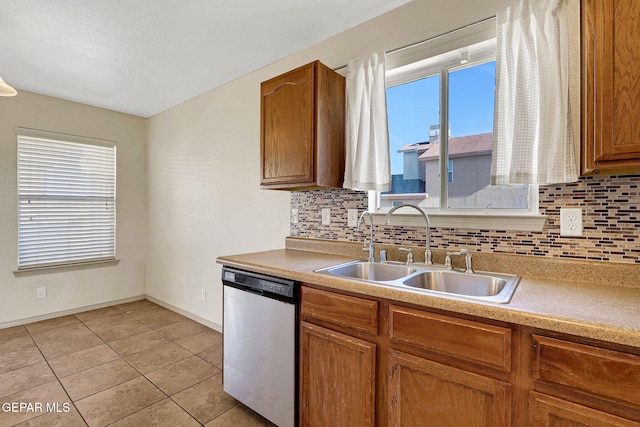3929 Hueco Valley Dr, El Paso, TX 79938 - kitchen featuring a sink, decorative backsplash, dishwasher, and a healthy amount of sunlight