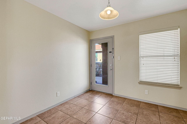 3929 Hueco Valley Dr, El Paso, TX 79938 - spare room featuring light tile patterned flooring and baseboards