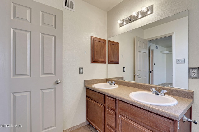 3929 Hueco Valley Dr, El Paso, TX 79938 - bathroom with visible vents, a sink, and double vanity