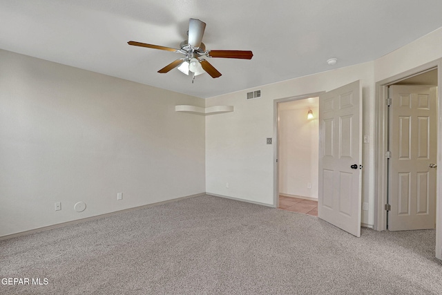 3929 Hueco Valley Dr, El Paso, TX 79938 - empty room with a ceiling fan, light colored carpet, visible vents, and baseboards