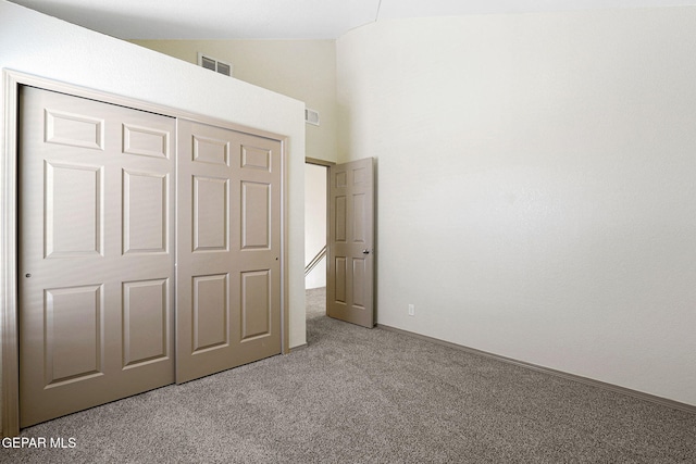 3929 Hueco Valley Dr, El Paso, TX 79938 - unfurnished bedroom with a closet, visible vents, lofted ceiling, and light colored carpet