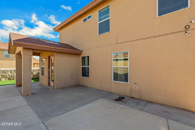 3929 Hueco Valley Dr, El Paso, TX 79938 - view of property exterior with a patio area and stucco siding