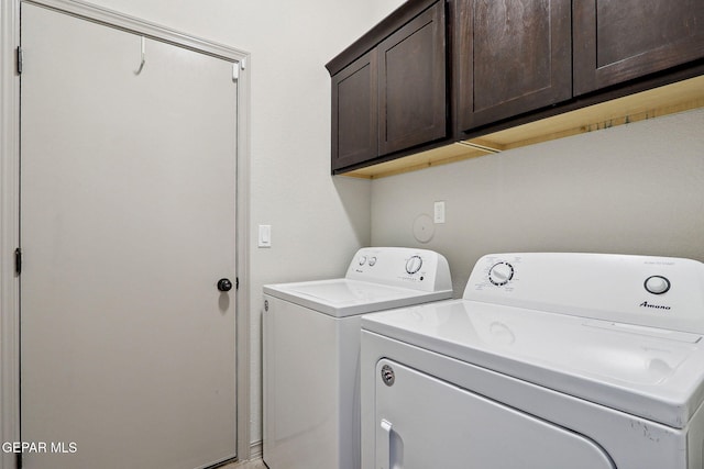laundry area featuring cabinet space and independent washer and dryer