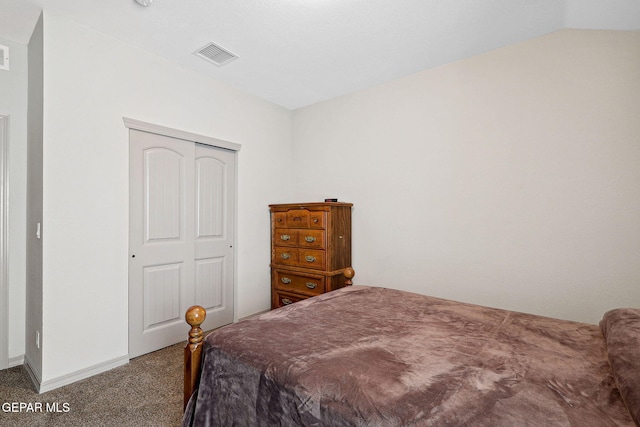 bedroom featuring carpet flooring, visible vents, vaulted ceiling, and a closet