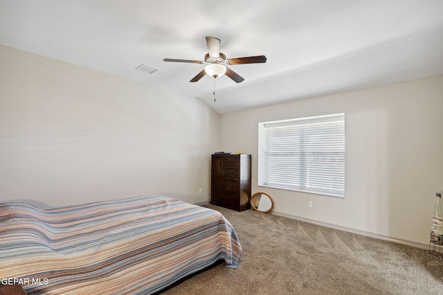 bedroom featuring carpet floors, a ceiling fan, baseboards, and lofted ceiling