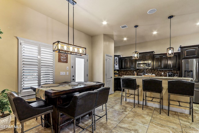 dining room featuring recessed lighting and visible vents
