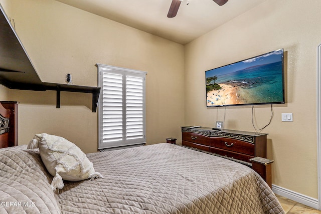 bedroom with baseboards and a ceiling fan